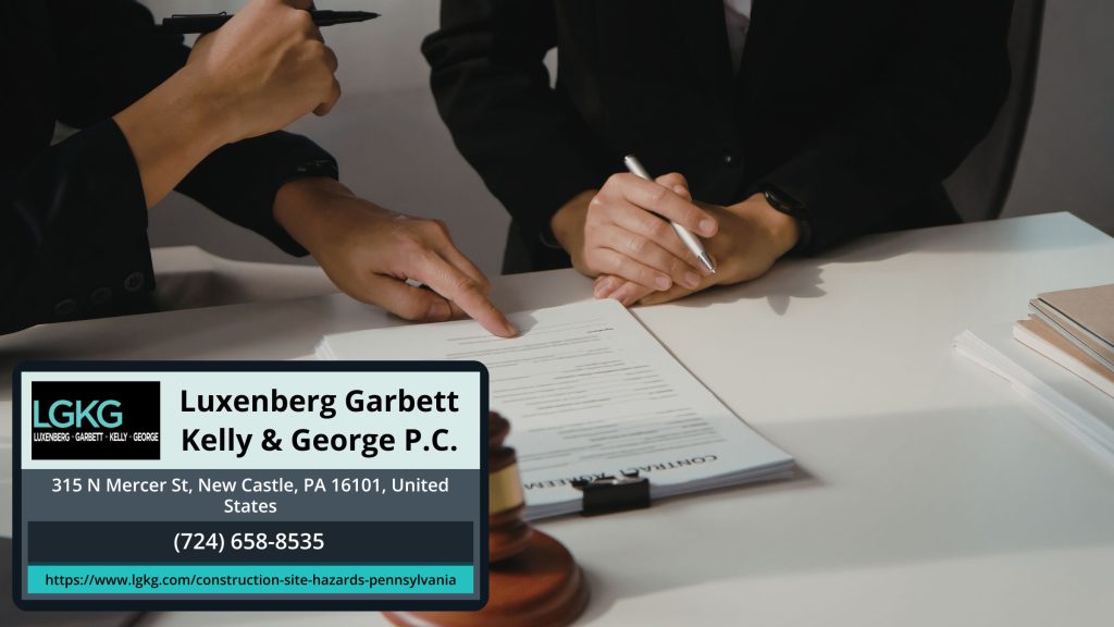 Lawyers reviewing contract at Luxenberg Garbett Kelly & George.